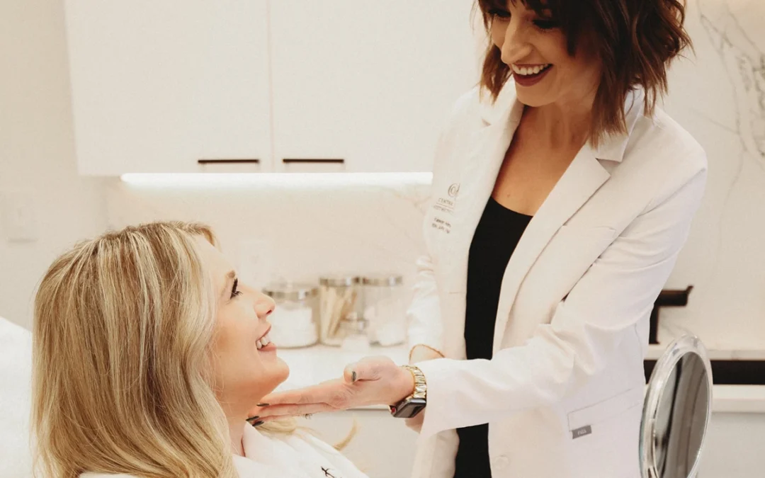 A smiling doctor in a white coat gently examines a seated, smiling patient in a modern clinic. The atmosphere is warm and professional.