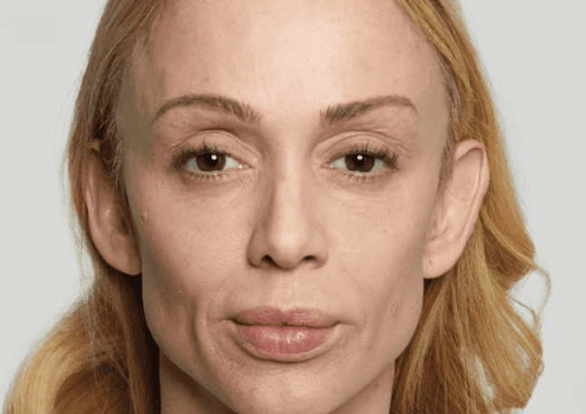 A woman with blonde hair in a white shirt, posing against a neutral background with a friendly demeanor.